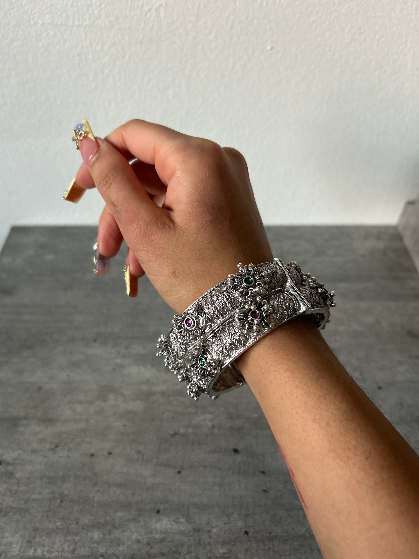 Silver bangle with dangles